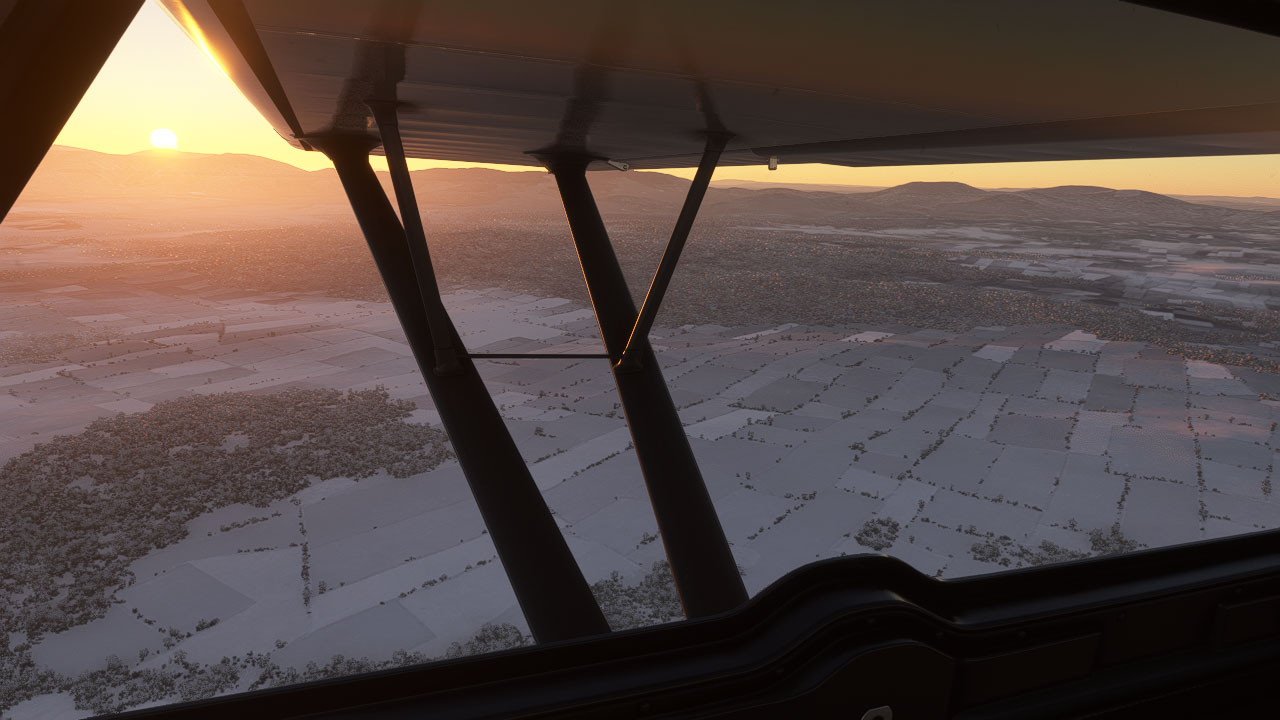 fichier article, Le soleil se lève sur la plaine enneigée.